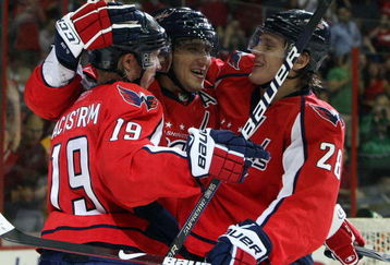 WASHINGTON DC, DC - SEPTEMBER 23:  Alex Ovechkin #8 of the Washington Capitals celebrates his second period goal against the Chicago Blackhawks with teammates Nicklas Backstrom #19 and Alexander Semin #28 during their preseason game on September 23, 2009 at the Verizon Center in Washington, DC.  (Photo by Jim McIsaac/Getty Images)