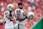 KANSAS CITY, MO - SEPTEMBER 20:  Defensive end Richard Seymour #92 of the Oakland Raiders walks onto the field with Nnamdi Asomugha #21 during the game against the Kansas City Chiefs at Arrowhead Stadium on September 20, 2009 in Kansas City, Missouri.  (Photo by Jamie Squire/Getty Images)