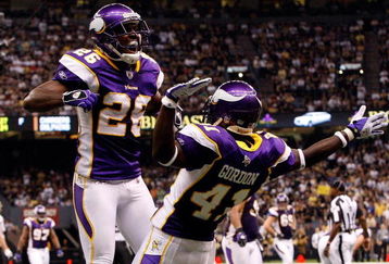 NEW ORLEANS - OCTOBER 06:  Antoine Winfield #26 and Charles Gordon #41 of the Minnesota Vikings celebrate after breaking up a touchdown pass against the New Orleans Saints on October 6, 2008 at the Superdome in New Orleans, Louisiana.  (Photo by Chris Graythen/Getty Images)