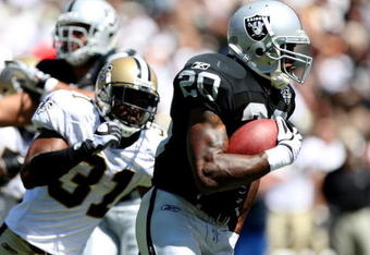 OAKLAND, CA - AUGUST 29:  Running back Darren McFadden #20 of the Oakland Raiders runs the ball against Pierson Prioleau #31 of the New Orleans Saints during the preseason game at Oakland-Alameda County Coliseum on August 29, 2009 in Oakland, California. (Photo by Jed Jacobsohn/Getty Images)