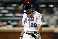 NEW YORK - SEPTEMBER 23:  Daniel Murphy #28 of the New York Mets walks to the dugout after striking out against the Atlanta Braves during the game on September 23, 2009 at Citi Field in the Flushing neighborhood of the Queens borough of New York City.  (Photo by Jared Wickerham/Getty Images)