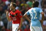 MANCHESTER, ENGLAND - SEPTEMBER 20:  Michael Owen of Manchester United celebrates scoring the winning goal in injury time during the Barclays Premier League match between Manchester United and Manchester City at Old Trafford on September 20, 2009 in Manchester, England.  (Photo by Alex Livesey/Getty Images)