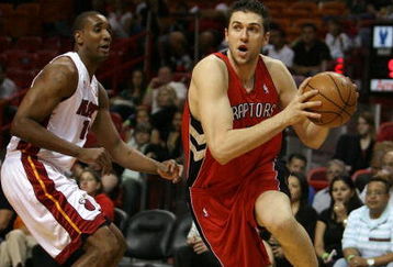 MIAMI - MARCH 05:  Andrea Bargnani #7 of the Toronto Raptors drives past Mark Blount #15 of the Miami Heat at American Airlines Arena on March 5,  2008 in Miami, Florida.  NOTE TO USER: User expressly acknowledges and agrees that, by downloading and or using this photograph, User is consenting to the terms and conditions of the Getty Images License Agreement.  (Photo by Doug Benc/Getty Images)