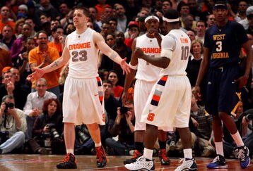 NEW YORK - MARCH 13: Eric Devendorf #23, Paul Harris #11 and Jonny Flynn #10 of the Syracuse Orange react on the court late in the game while Devin Ebanks #3 of the West Virginia Mountaineers looks on during the semifinal round of the Big East Tournament at Madison Square Garden on March 13, 2009 in New York City.  (Photo by Jim McIsaac/Getty Images)