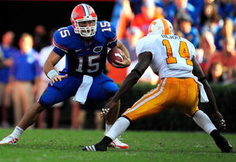 GAINESVILLE, FL - SEPTEMBER 19:  Tim Tebow #15 of the Florida Gators is cornered by Eric Berry #14 of the Tennessee Volunteers during the game at Ben Hill Griffin Stadium on September 19, 2009 in Gainesville, Florida.  (Photo by Sam Greenwood/Getty Images)
