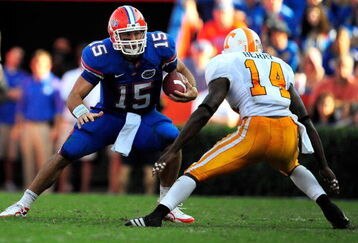 GAINESVILLE, FL - SEPTEMBER 19:  Tim Tebow #15 of the Florida Gators is cornered by Eric Berry #14 of the Tennessee Volunteers during the game at Ben Hill Griffin Stadium on September 19, 2009 in Gainesville, Florida.  (Photo by Sam Greenwood/Getty Images)