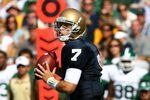 SOUTH BEND, IN - SEPTEMBER 19: Jimmy Clausen #7 of the Notre Dame Fighting Irish looks for a receiver against the Michigan State Spartans on September 19, 2009 at Notre Dame Stadium in South Bend, Indiana. Notre Dame defeated Michigan State 33-30. (Photo by Jonathan Daniel/Getty Images)