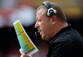 KANSAS CITY, MO - SEPTEMBER 20:  Head coach Tom Cable of the Oakland Raiders calls plays from the bench during the game against the Kansas City Chiefs at Arrowhead Stadium on September 20, 2009 in Kansas City, Missouri.  (Photo by Jamie Squire/Getty Images)