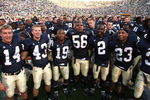 SOUTH BEND, IN - SETPEMBER 19: Players from the Notre Dame Fighting Irish including (L-R) Brandon Walker #14, Eric Maust #43, George West #19, Kerry Neal #56, Darrin Walls #2, Golden Tate #23 and Sergio Brown #31, sing with students after a win over the Michigan State Spartans on September 19, 2009 at Notre Dame Stadium in South Bend, Indiana. Notre Dame defeated Michigan State 33-30. (Photo by Jonathan Daniel/Getty Images)