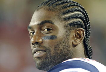 TAMPA, FL - AUGUST 17: Wide receiver Randy Moss #81 of the New England Patriots watches play against the Tampa Bay Buccaneers at Raymond James Stadium on August 17, 2008 in Tampa, Florida. (Photo by Al Messerschmidt/Getty Images)