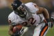 GREEN BAY, WI - SEPTEMBER 13: Matt Forte #22 of the Chicago Bears tries to gain yardage against the Green Bay Packers on September 13, 2009 at Lambeau Field in Green Bay, Wisconsin. The Packers defeated the Bears 21-15. (Photo by Jonathan Daniel/Getty Images)