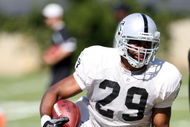 NAPA, CA - AUGUST 05: Michael Bush #29 runs with the ball during the Oakland Raiders Training Camp at the Napa Valley Marriott on August 5, 2009 in Napa, California.  (Photo by Jed Jacobsohn/Getty Images)
