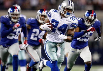 ARLINGTON, TX - SEPTEMBER 20:  Running back Marion Barber #24 of the Dallas Cowboys runs the ball past Bruce Johnson #25 of the New York Giants at Cowboys Stadium on September 20, 2009 in Arlington, Texas.  (Photo by Ronald Martinez/Getty Images)