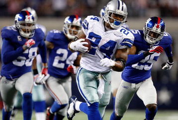 ARLINGTON, TX - SEPTEMBER 20:  Running back Marion Barber #24 of the Dallas Cowboys runs the ball past Bruce Johnson #25 of the New York Giants at Cowboys Stadium on September 20, 2009 in Arlington, Texas.  (Photo by Ronald Martinez/Getty Images)
