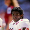 1989-1990:  Defensive back Deion Sanders of the Atlanta Falcons looks on during a game against the Dallas Cowboys at Fulton County Stadium in Atlanta, Georgia.  The Falcons won the game 27-21. Mandatory Credit: Allen Steele  /Allsport