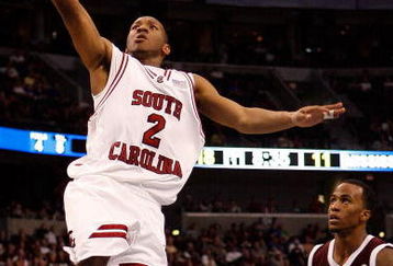 TAMPA, FL - MARCH 13:  Devan Downey #2 of the South Carolina Gamecocks makes a layup around Dee Bost #3 of the Mississippi State Bulldogs during the quaterfinal round of the SEC Men's Basketball Tournament on March 13, 2009 at The St. Pete Times Forum in Tampa, Florida.  (Photo by Chris Graythen/Getty Images)