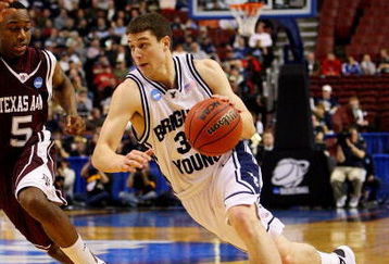 PHILADELPHIA - MARCH 19:  Jimmer Fredette #32 of the Brigham Young Cougars drives against Dash Harris #5 of the Texas A&M Aggies during the first round of the NCAA Division I Men's Basketball Tournament at the Wachovia Center on March 19, 2009 in Philadelphia, Pennsylvania.  (Photo by Jim McIsaac/Getty Images)