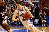 PHILADELPHIA - MARCH 19:  Jimmer Fredette #32 of the Brigham Young Cougars drives against Dash Harris #5 of the Texas A&M Aggies during the first round of the NCAA Division I Men's Basketball Tournament at the Wachovia Center on March 19, 2009 in Philadelphia, Pennsylvania.  (Photo by Jim McIsaac/Getty Images)