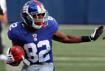EAST RUTHERFORD, NJ - SEPTEMBER 13:  Mario Manningham #82 of the New York Giants runs in a second quarter touchdown against the Washington Redskins on September 13, 2009 at Giants Stadium in East Rutherford, New Jersey.  (Photo by Jim McIsaac/Getty Images)
