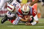 FOXBORO, MA - SEPTEMBER 14:  Quarterback Tom Brady #12 of the New England Patriots is sacked by Aaron Schobel #94 of the Buffalo Bills on September 14, 2009 at Gillette Stadium in Foxboro, Massachusetts. (Photo by Elsa/Getty Images)