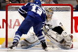 TORONTO - SEPTEMBER 22:  Lee Stempniak #12 of the Toronto Maple Leafs scores on John Curry #36 of the Pittsburgh Penguins in the shoot-out during a pre-season  NHL game at the Air Canada Centre on September 22, 2009 in Toronto, Ontario, Canada .  (Photo by Abelimages/Getty Images)