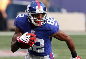 EAST RUTHERFORD, NJ - SEPTEMBER 13:  Mario Manningham #82 of the New York Giants runs in a second quarter touchdown against the Washington Redskins on September 13, 2009 at Giants Stadium in East Rutherford, New Jersey.  (Photo by Jim McIsaac/Getty Images)