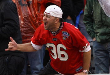 ATHENS, GA - NOVEMBER 29:  A Georgia Bulldogs fan yells during a defensive stand during the game between the Georgia Tech Yellow Jackets and the Georgia Bulldogs at Sanford Stadium on November 29, 2008 in Athens, Georgia.  The Yellow Jackets beat Bulldogs 45-42.  (Photo by Mike Zarrilli/Getty Images)