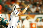 MIAMI - SEPTEMBER 21:  Quarterback Peyton Manning #18 of the Indianapolis Colts points out to his wide receiver against the Miami Dolphins at Land Shark Stadium on September 21, 2009 in Miami, Florida. The Colts defeated the Dolphins 27-23.  (Photo by Doug Benc/Getty Images)