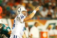 MIAMI - SEPTEMBER 21:  Quarterback Peyton Manning #18 of the Indianapolis Colts points out to his wide receiver against the Miami Dolphins at Land Shark Stadium on September 21, 2009 in Miami, Florida. The Colts defeated the Dolphins 27-23.  (Photo by Doug Benc/Getty Images)