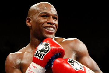 LAS VEGAS - SEPTEMBER 19:  Floyd Mayweather Jr. smiles in the ring during his fight against Juan Manuel Marquez at the MGM Grand Garden Arena September 19, 2009 in Las Vegas, Nevada. Mayweather won by unanimous decision.  (Photo by Ethan Miller/Getty Images)