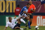 CHICAGO - JUNE 06: Amado Guevara #7 of Honduras collides with Ricardo Clark #2 of the United States as they pursue the ball during a FIFA 2010 World Cup Qualifying match on June 6, 2009 at Soldier Field in Chicago, Illinois. The United States defeated Honduras 2-1. (Photo by Jonathan Daniel/Getty Images)