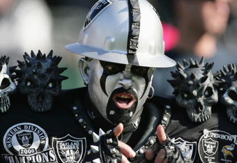 OAKLAND, CA - DECEMBER 19:  A fan of the Oakland Raiders cheers during the game against the Tennessee Titans at Network Associates Coliseum on December 19, 2004 in Oakland, California. (Photo by Jed Jacobsohn/Getty Images)