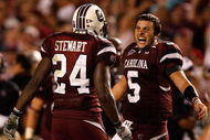 COLUMBIA, SC - SEPTEMBER 24:  Stephen Garcia #5 of the South Carolina Gamecocks celebrates with teammate Darian Stewart #24 after a 16-10 vicotry over the Ole Miss Rebels during their game at Williams-Brice Stadium on September 24, 2009 in Columbia, South Carolina.  (Photo by Streeter Lecka/Getty Images)