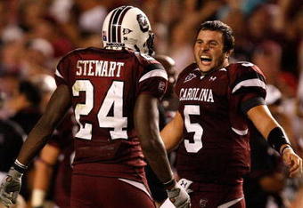 COLUMBIA, SC - SEPTEMBER 24:  Stephen Garcia #5 of the South Carolina Gamecocks celebrates with teammate Darian Stewart #24 after a 16-10 vicotry over the Ole Miss Rebels during their game at Williams-Brice Stadium on September 24, 2009 in Columbia, South Carolina.  (Photo by Streeter Lecka/Getty Images)