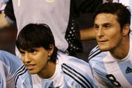 BUENOS AIRES, ARGENTINA - MARCH 28: Sergio Aguero of Argentina poses for photographs with his son Benjamin prior to the 2010 FIFA World Cup South African qualifier match between Argentina and Venezuela at River Plate Stadium on March 28, 2009 in Buenos Aires, Argentina. (Photo by Photogamma/Getty Images)