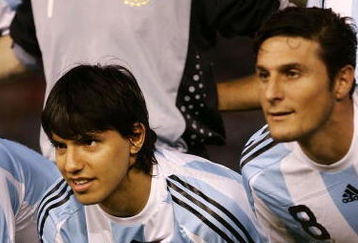 BUENOS AIRES, ARGENTINA - MARCH 28: Sergio Aguero of Argentina poses for photographs with his son Benjamin prior to the 2010 FIFA World Cup South African qualifier match between Argentina and Venezuela at River Plate Stadium on March 28, 2009 in Buenos Aires, Argentina. (Photo by Photogamma/Getty Images)