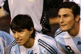 BUENOS AIRES, ARGENTINA - MARCH 28: Sergio Aguero of Argentina poses for photographs with his son Benjamin prior to the 2010 FIFA World Cup South African qualifier match between Argentina and Venezuela at River Plate Stadium on March 28, 2009 in Buenos Aires, Argentina. (Photo by Photogamma/Getty Images)