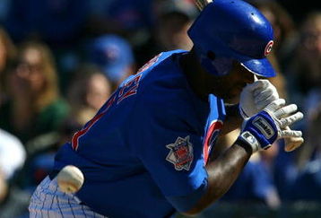 CHICAGO - AUGUST 30: Milton Bradley #21 of the Chicago Cubs is hit by a pitch from Nelson Figueroa of the New York Mets in the 5th inning on August 30, 2009 at Wrigley Field in Chicago, Illinois. (Photo by Jonathan Daniel/Getty Images)
