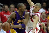 HOUSTON - MAY 14:  Guard Kobe Bryant #24 of the Los Angeles Lakers dribbles the ball past Shane Battier #31 of the Houston Rockets in Game Six of the Western Conference Semifinals during the 2009 NBA Playoffs at Toyota Center on May 14, 2009 in Houston, Texas. NOTE TO USER: User expressly acknowledges and agrees that, by downloading and or using this photograph, User is consenting to the terms and conditions of the Getty Images License Agreement.  (Photo by Ronald Martinez/Getty Images)
