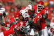 PISCATAWAY, NJ - SEPTEMBER 29: Jason McCourty #25 and Ron Girault #43 of the Rutgers Scarlet Knights tackle Da'Rel Scott #23 of the Maryland Terrapins during their game at Rutgers Stadium on September 29, 2007 in Piscataway, New Jersey. (Photo by Nick Laham/Getty Images)