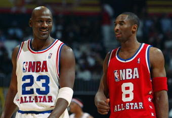 ATLANTA - FEBRUARY 9:  Michael Jordan (Washington Wizards) #23 of the Eastern Conference All-Stars talks with Kobe Bryant (Los Angeles Lakers) #8 of the Western Conference All-Stars at the 2003 NBA All-Star Game on February 9, 2003 at Philips Arena in Atlanta, Georgia.  NOTE TO USER:  User expressly acknowledges and agrees that, by downloading and or using this photograph, user is consenting to the terms and conditions of the Getty Images license agreement. (Photo by Jamie Squire/Getty Images)