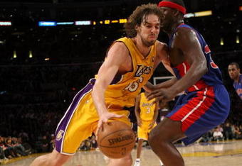 LOS ANGELES, CA - NOVEMBER 14:  Pau Gasol #16 of the Los Angeles Lakers drives around Kwame Brown #38 of the Detroit Pistons on November 14, 2008 at Staples Center in Los Angeles, California. The Pistons won 106-95.   NOTE TO USER: User expressly acknowledges and agrees that, by downloading and/or using this Photograph, user is consenting to the terms and conditions of the Getty Images License Agreement.  (Photo by Stephen Dunn/Getty Images)