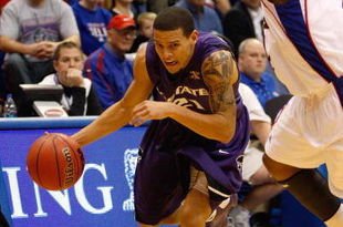 LAWRENCE, KS - JANUARY 13: Denis Clemente #21 of the Kansas State Wildcats dribbles the ball to the basket during the game against the Kansas Jayhawks on January 13, 2009 at Allen Fieldhouse in Lawrence, Kansas. The Jayhawks defeated the Wildcats 87-71. (Photo by Jamie Squire/Getty Images)