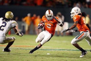 FORT LAUDERDALE, FL - SEPTEMBER 17:  Running back Graig Cooper #2 of the Miami Hurricanes looks to avoid being brought down by cornerback Mario Butler #2 of the Georgia Tech Yellow Jackets at Land Shark Stadium on September 17, 2009 in Fort Lauderdale, Florida. Miami defeated Georgia Tech 33-17.  (Photo by Doug Benc/Getty Images)