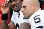 KANSAS CITY, MO - SEPTEMBER 20:  Quarterback JaMarcus Russell #2 of the Oakland Raiders talks with Bruce Gradkowski #5 on the bench during the game against the Kansas City Chiefs at Arrowhead Stadium on September 20, 2009 in Kansas City, Missouri.  (Photo by Jamie Squire/Getty Images)