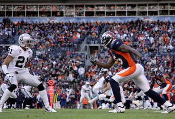 DENVER - NOVEMBER 23:  Wide receiver Brandon Marshall #15 of the Denver Broncos leaves the line of scrimmage against cornerback Nnamdi Asomgha #21 of the Oakland Raiders during week 12 NFL action at Invesco Field at Mile High on November 23, 2008 in Denver, Colorado. The Raiders defeated the Broncos 31-10.  (Photo by Doug Pensinger/Getty Images)