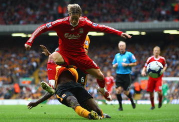 LIVERPOOL, ENGLAND - SEPTEMBER 26:  Fernando Torres of Liverpool is tackled by Ibrahima Sonko of Hull City during the Barclays Premier League match between Liverpool and Hull City at Anfield on September 26, 2009 in Liverpool, England.  (Photo by Clive Brunskill/Getty Images)