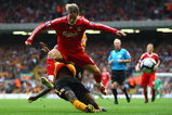 LIVERPOOL, ENGLAND - SEPTEMBER 26:  Fernando Torres of Liverpool is tackled by Ibrahima Sonko of Hull City during the Barclays Premier League match between Liverpool and Hull City at Anfield on September 26, 2009 in Liverpool, England.  (Photo by Clive Brunskill/Getty Images)