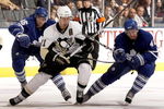 TORONTO - SEPTEMBER 22: Viktor Stahlberg #45 and Tyler Bozak #42 of the Toronto Maple Leafs hook Jordan Staal #11of the Pittsburgh Penguins during a pre-season  NHL game at the Air Canada Centre on September 22, 2009 in Toronto, Ontario, Canada.  (Photo by Abelimages/Getty Images)
