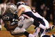 OAKLAND, CA - SEPTEMBER 08: John Engelberger #60 of the Denver Broncos tackles Darren McFadden #20 of the Oakland Raiders during an NFL game at McAfee Coliseum on September 8, 2008 in Oakland, California.  (Photo by Jed Jacobsohn/Getty Images)